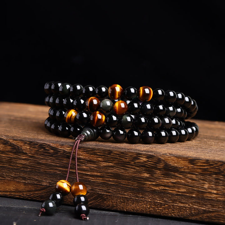 Pulsera de obsidiana negra con 108 cuentas de mala y Buddha Stones