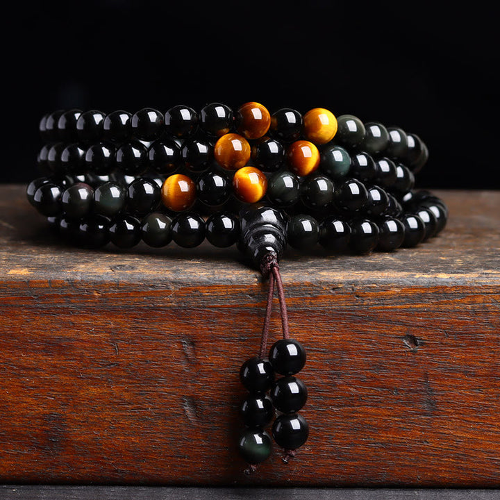 Pulsera de obsidiana negra con 108 cuentas de mala y Buddha Stones