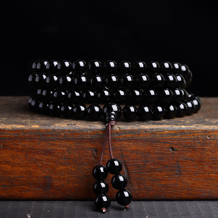 Pulsera de obsidiana negra con 108 cuentas de mala y Buddha Stones