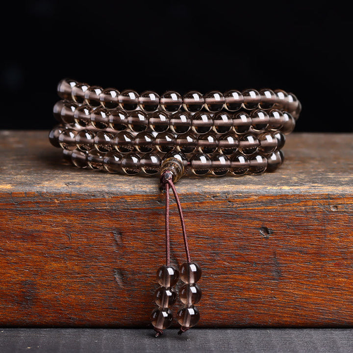 Pulsera de obsidiana negra con 108 cuentas de mala y Buddha Stones