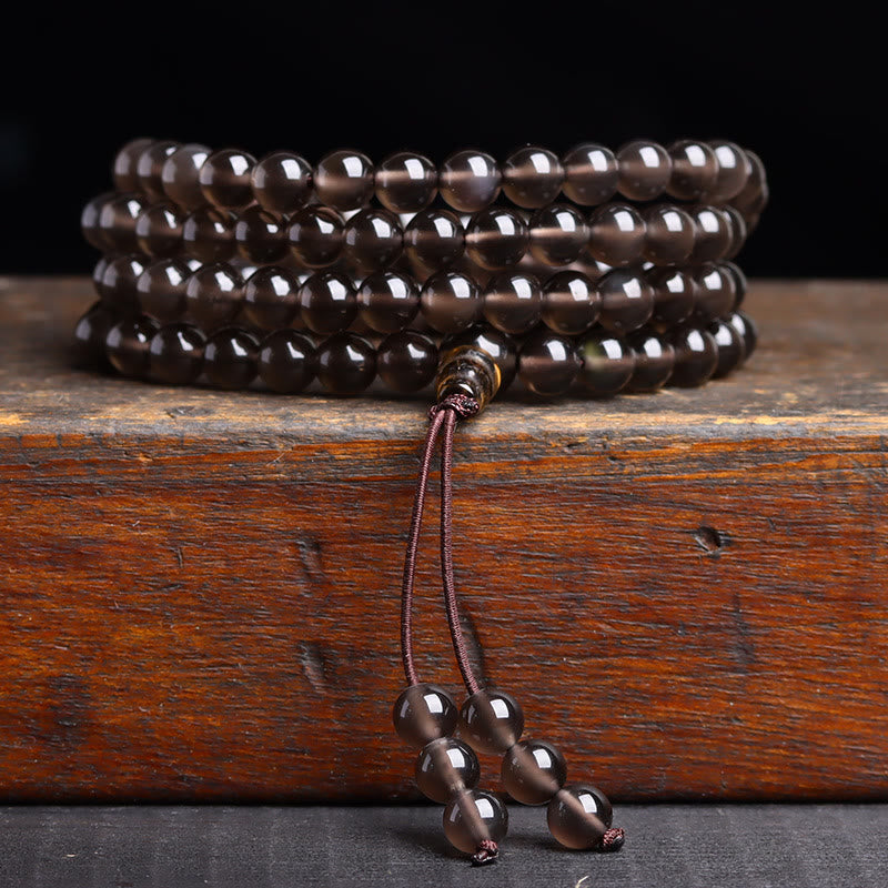Pulsera de obsidiana negra con 108 cuentas de mala y Buddha Stones
