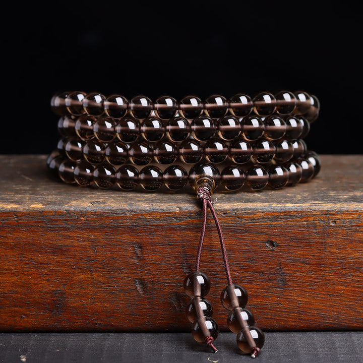 Pulsera de obsidiana negra con 108 cuentas de mala y Buddha Stones