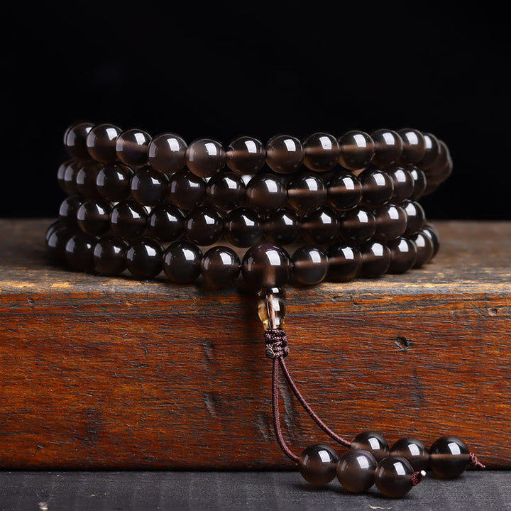 Pulsera de obsidiana negra con 108 cuentas de mala y Buddha Stones