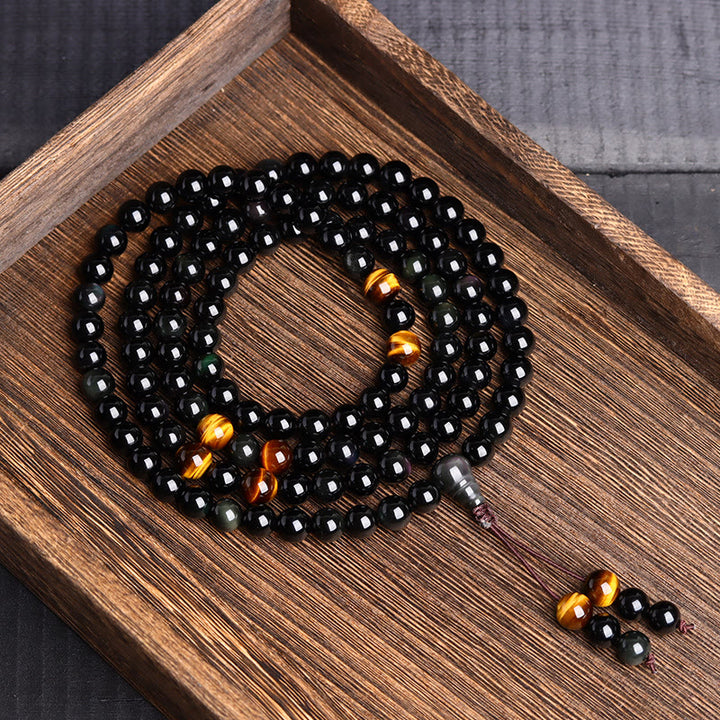 Pulsera de obsidiana negra con 108 cuentas de mala y Buddha Stones