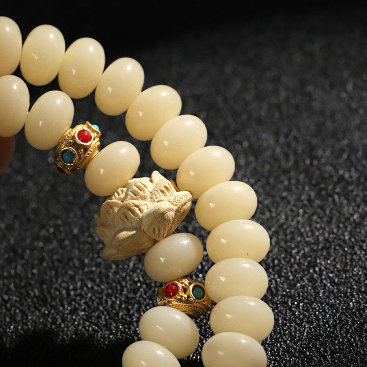 Pulsera de doble vuelta con Buddha Stones de Bodhi y madera de durazno y loto para la riqueza