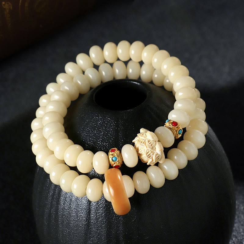 Pulsera de doble vuelta con Buddha Stones de Bodhi y madera de durazno y loto para la riqueza