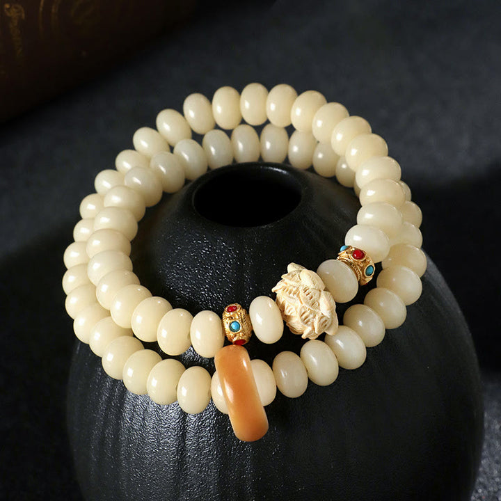 Pulsera de doble vuelta con Buddha Stones de Bodhi y madera de durazno y loto para la riqueza