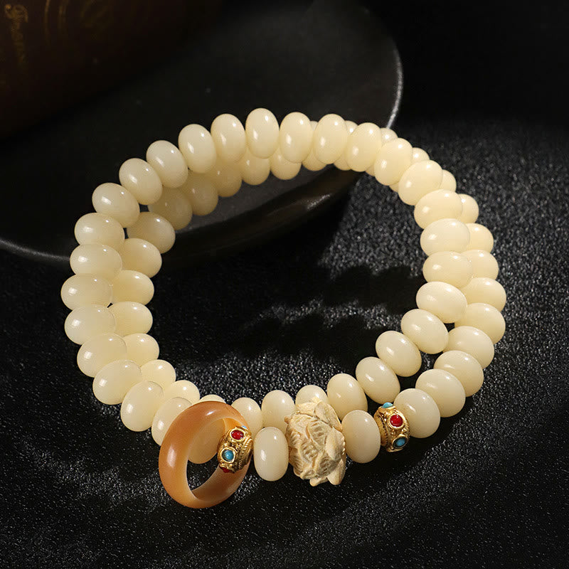 Pulsera de doble vuelta con Buddha Stones de Bodhi y madera de durazno y loto para la riqueza