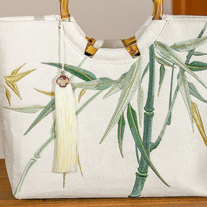 Bolsos de mano con borlas y asas de bambú bordadas con Buddha Stones