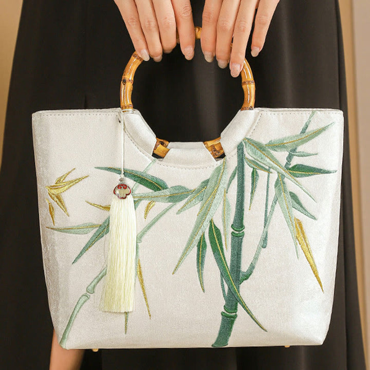 Bolsos de mano con borlas y asas de bambú bordadas con Buddha Stones