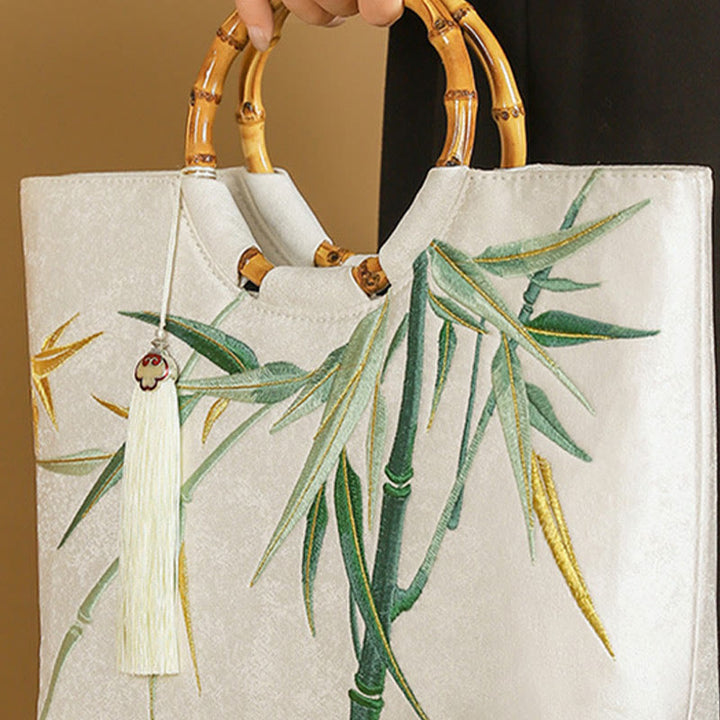 Bolsos de mano con borlas y asas de bambú bordadas con Buddha Stones