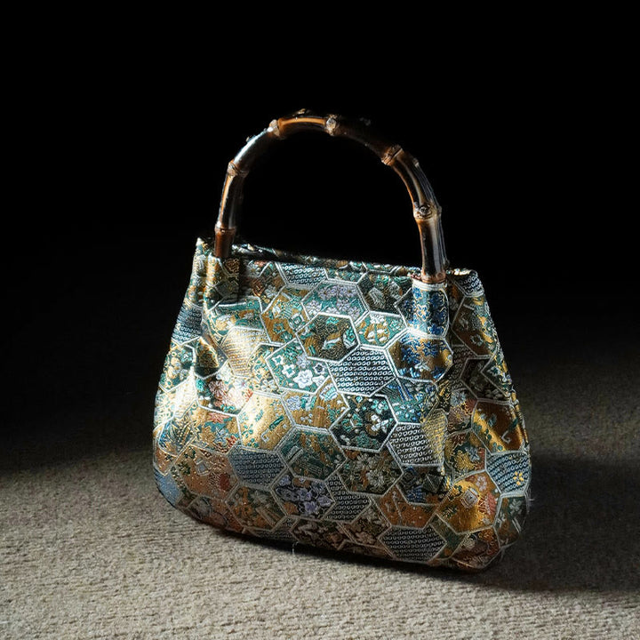 Bolso bandolera con cadena de metal y asa de bambú con diseño de Buddha Stones