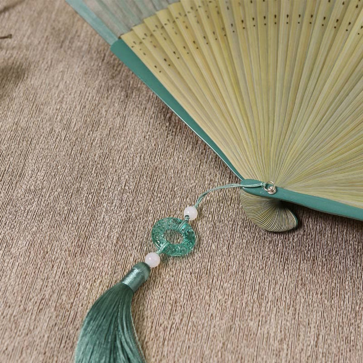 Abanico plegable de bambú de mano con diseño de grulla de río y montaña retro con Buddha Stones