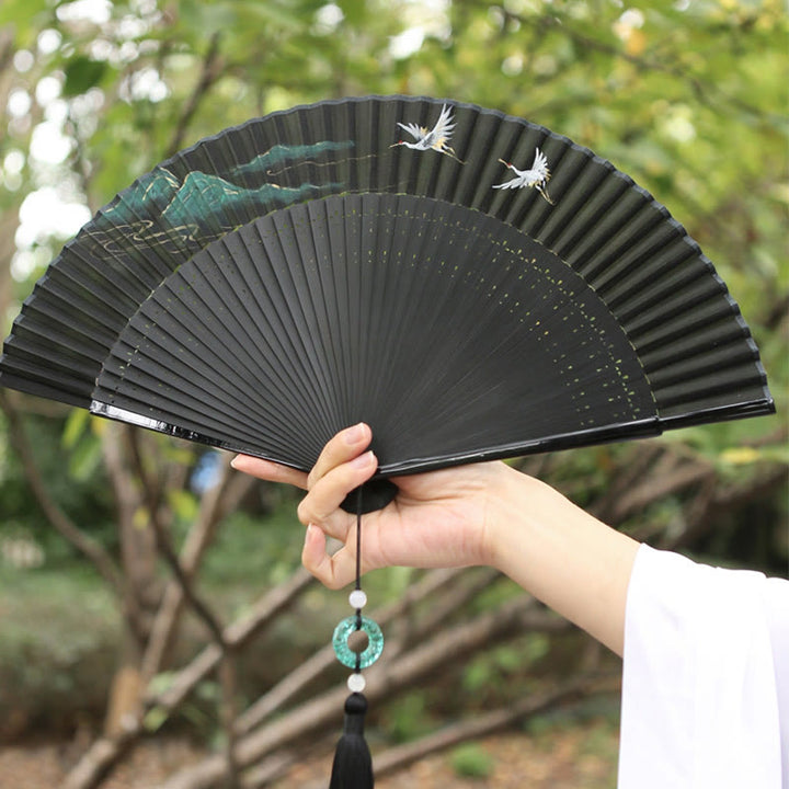 Abanico plegable de bambú de mano con diseño de grulla de río y montaña retro con Buddha Stones