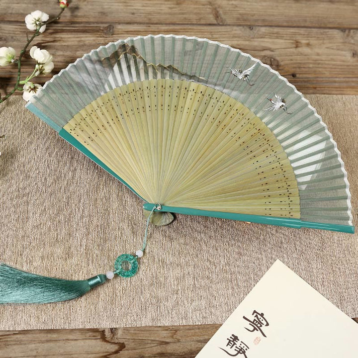 Abanico plegable de bambú de mano con diseño de grulla de río y montaña retro con Buddha Stones