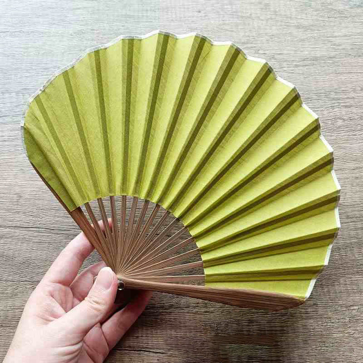Abanico plegable de bambú de mano con forma de concha de color sólido retro con Buddha Stones