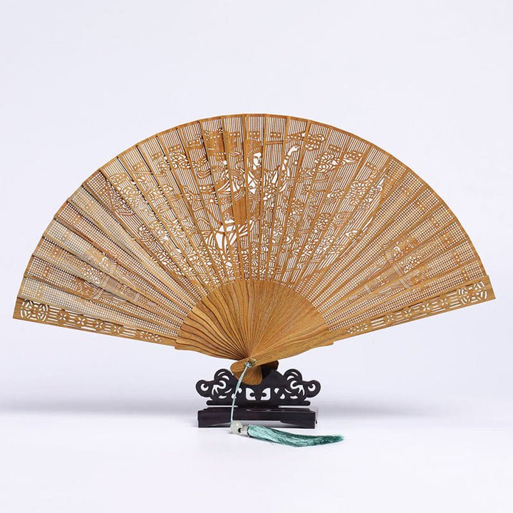 Abanico plegable de mano de madera de sándalo verde con diseño grabado de Buddha Stones auspiciosas, grulla, pavo real, Chang'e y luna