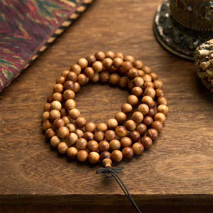 Pulsera de protección pulida a mano de madera de durazno con 108 cuentas de mala y Buddha Stones con efecto relámpago