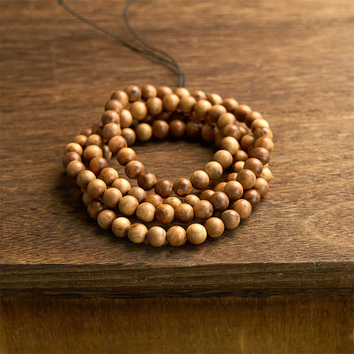Pulsera de protección pulida a mano de madera de durazno con 108 cuentas de mala y Buddha Stones con efecto relámpago