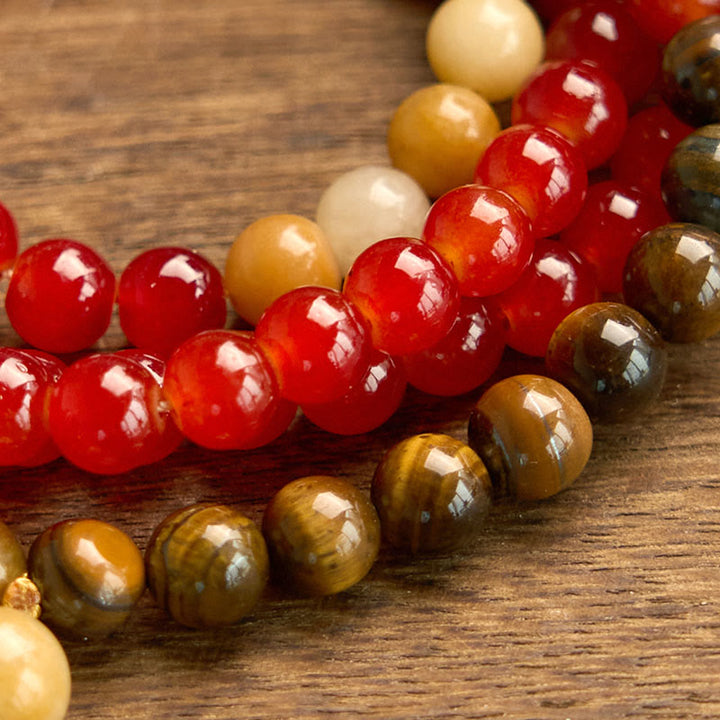 Buddha Stones con 108 cuentas de mala, ágata roja, ojo de tigre y borla amarilla