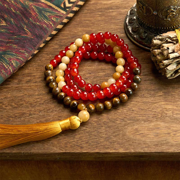 Buddha Stones con 108 cuentas de mala, ágata roja, ojo de tigre y borla amarilla