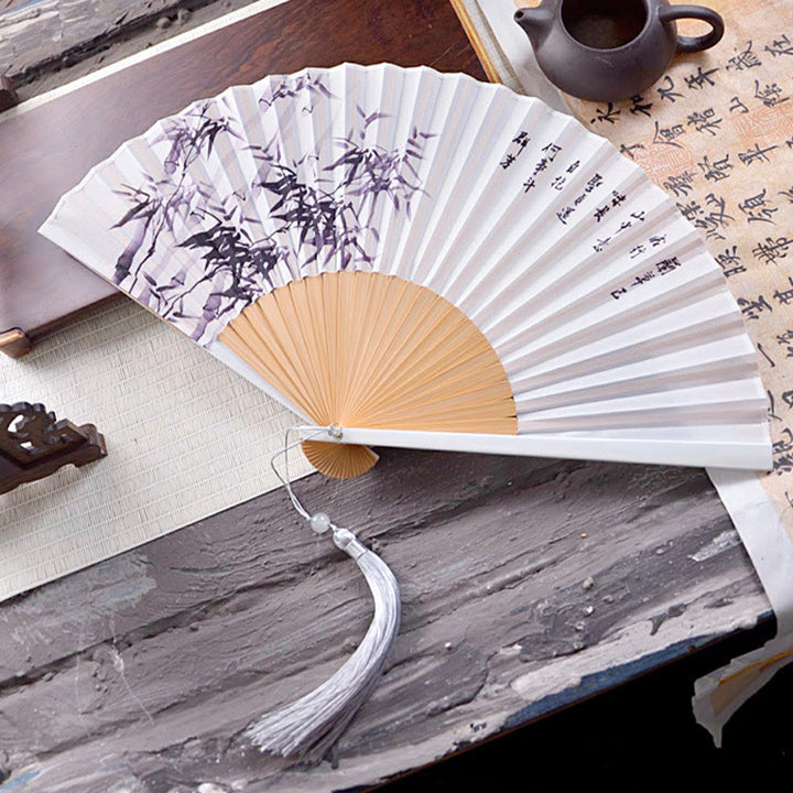 Abanico plegable de bambú y crepé de poliéster de 23,3 cm con pintura en tinta de caracteres chinos, diseño de flores de Buddha Stones y hojas