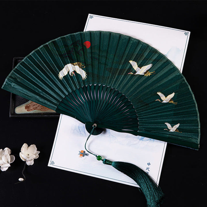 Ventilador plegable de bambú de mano con diseño de Buddha Stones, grullas y nubes auspiciosas, color sólido degradado. - Grulla puesta de sol verde oscuro de 21 cm - image 0