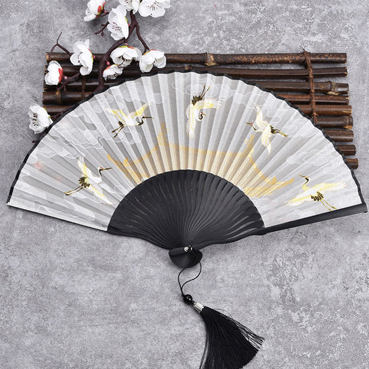 Abanico plegable de bambú con tela de lino y algodón de color liso con degradado de grullas y piedras de Buddha Stones y nubes auspiciosas