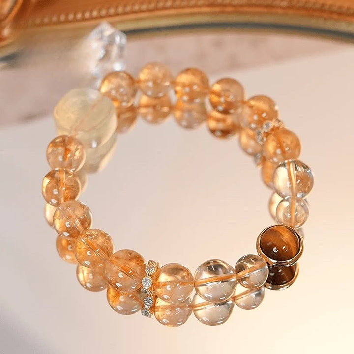 Pulsera de la diosa de la riqueza con zakiram, ojo de tigre, topacio y citrino de Buddha Stones