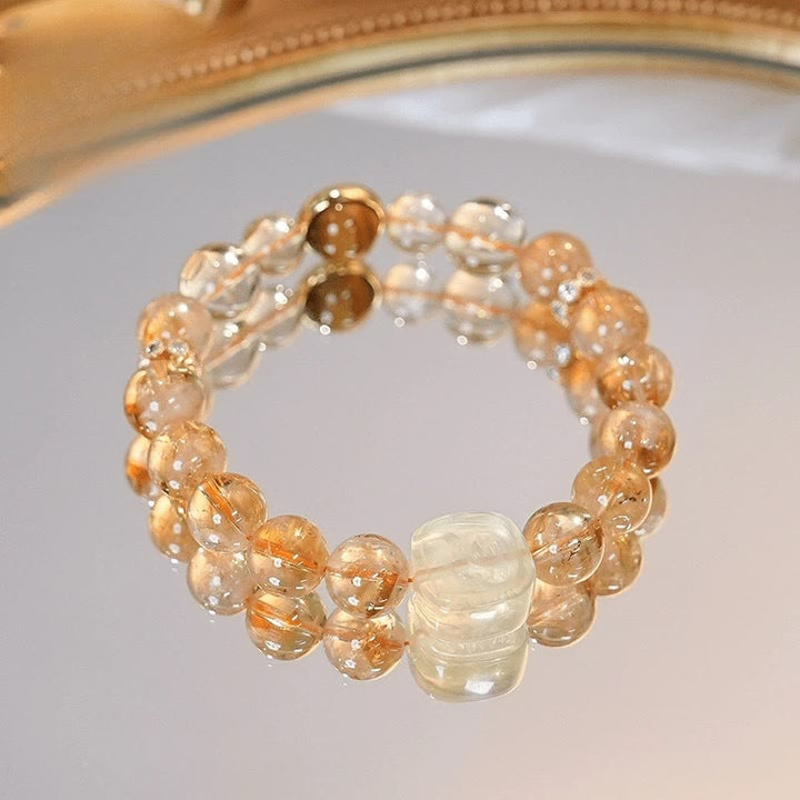 Pulsera de la diosa de la riqueza con zakiram, ojo de tigre, topacio y citrino de Buddha Stones