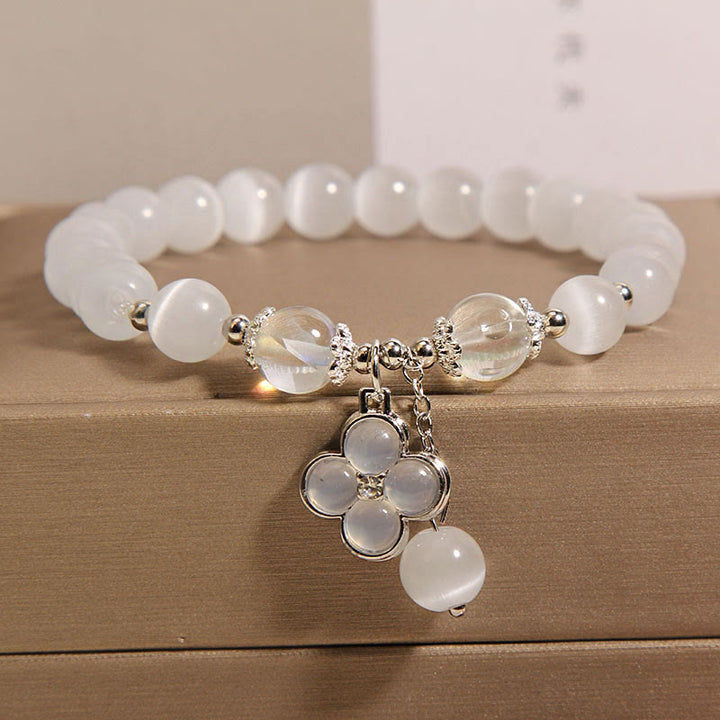 Pulsera con dije de trébol de cuatro hojas de la suerte y cristal de ojo de gato con Buddha Stones