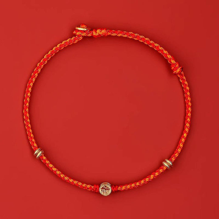 Pulsera de la suerte con el personaje Fu hecha a mano con hilo rojo trenzado y piedras de Buddha Stones en plata de ley 925