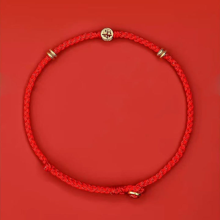 Pulsera de la suerte con el personaje Fu hecha a mano con hilo rojo trenzado y piedras de Buddha Stones en plata de ley 925