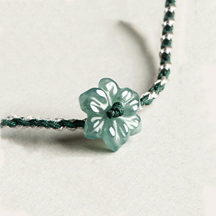 Pulsera de prosperidad trenzada con orquídea de jade y hilo verde hecha a mano con Buddha Stones