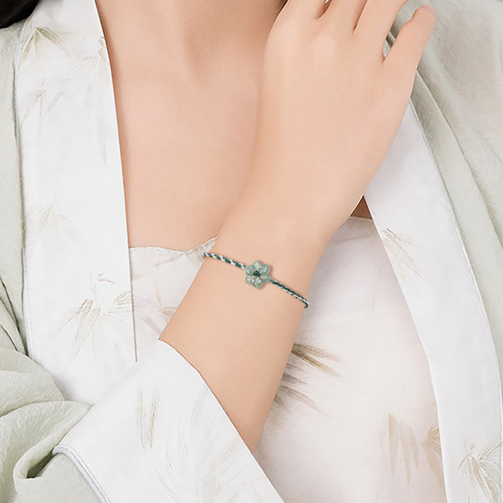 Pulsera de prosperidad trenzada con orquídea de jade y hilo verde hecha a mano con Buddha Stones
