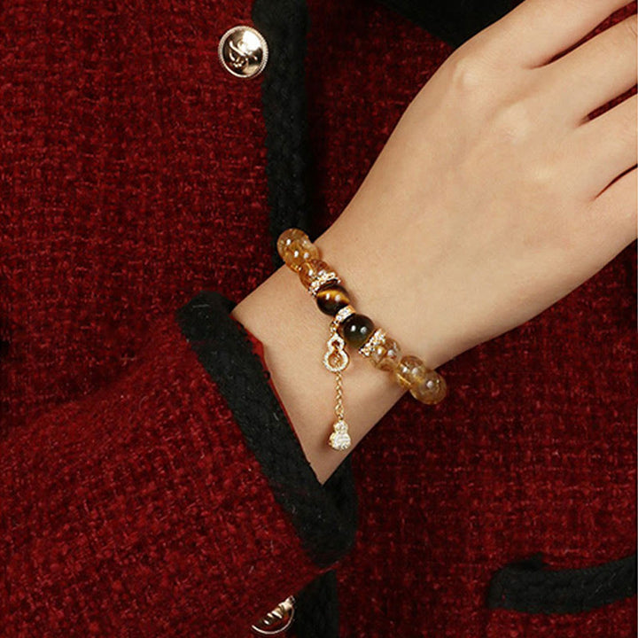 Pulsera de fuerza con calabaza de la suerte y cuentas de citrino y ojo de tigre natural de Buddha Stones
