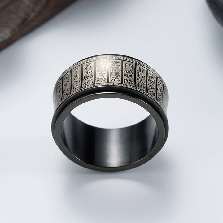 Anillo de equilibrio giratorio de acero y titanio con escritura de sello tibetano y mantra de luz dorada con Buddha Stones