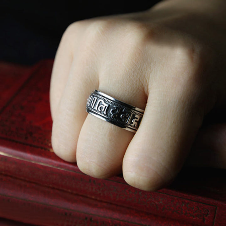 Anillo de equilibrio giratorio de acero y titanio con Buddha Stones tibetano Om Mani Padme Hum