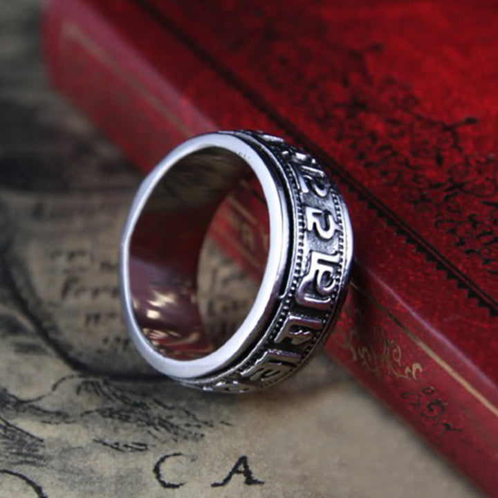Anillo de equilibrio giratorio de acero y titanio con Buddha Stones tibetano Om Mani Padme Hum