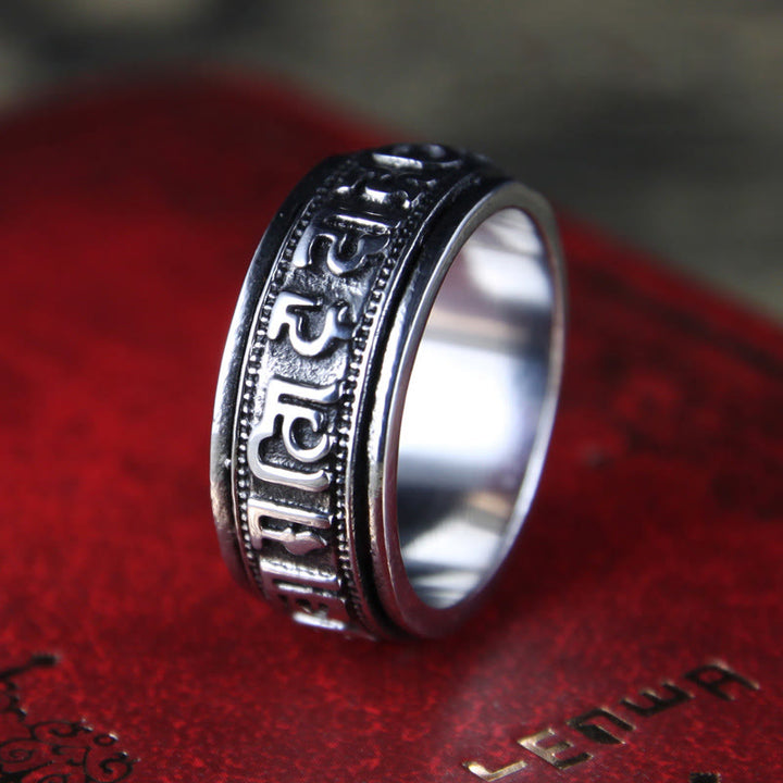 Anillo de equilibrio giratorio de acero y titanio con Buddha Stones tibetano Om Mani Padme Hum