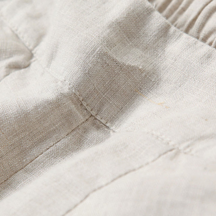 Pantalones de lino y algodón de color liso con cintura alta y pierna ancha y bolsillos con Buddha Stones