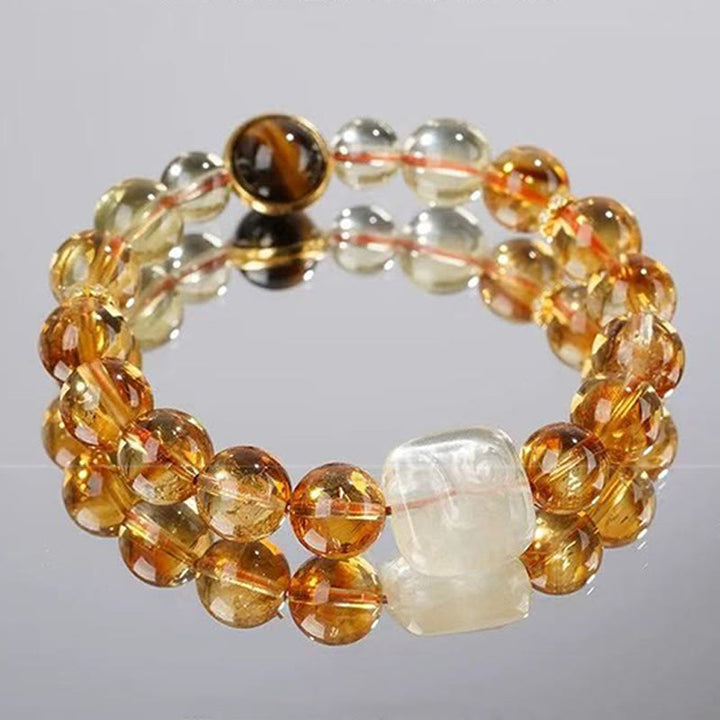 Buddha Stones Pulsera de bondad con topacio Zashi Lhamo