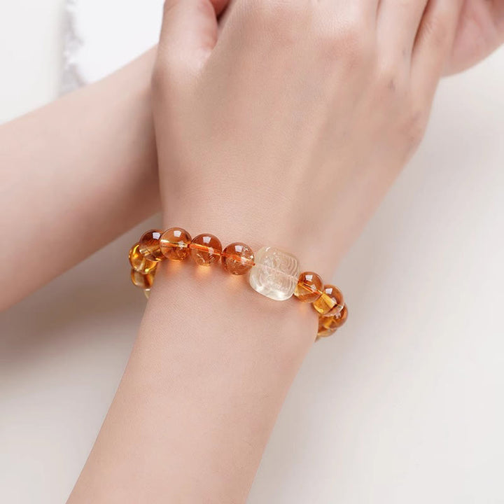 Buddha Stones Pulsera de bondad con topacio Zashi Lhamo