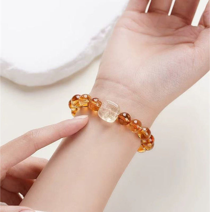 Buddha Stones Pulsera de bondad con topacio Zashi Lhamo
