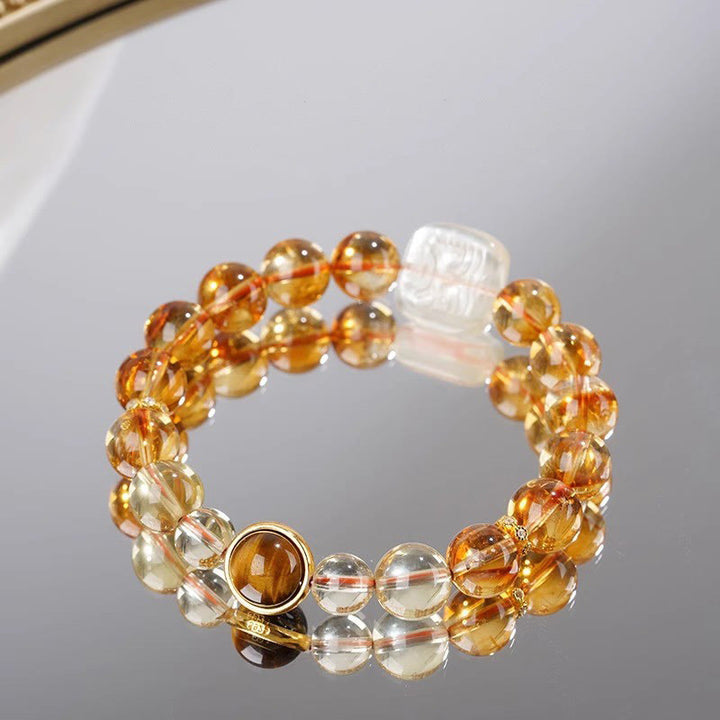 Buddha Stones Pulsera de bondad con topacio Zashi Lhamo