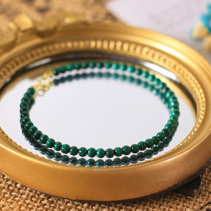 Pulsera antiansiedad de cobre bañada en oro de 14 k con cuentas de malaquita natural de 4 mm y Buddha Stones