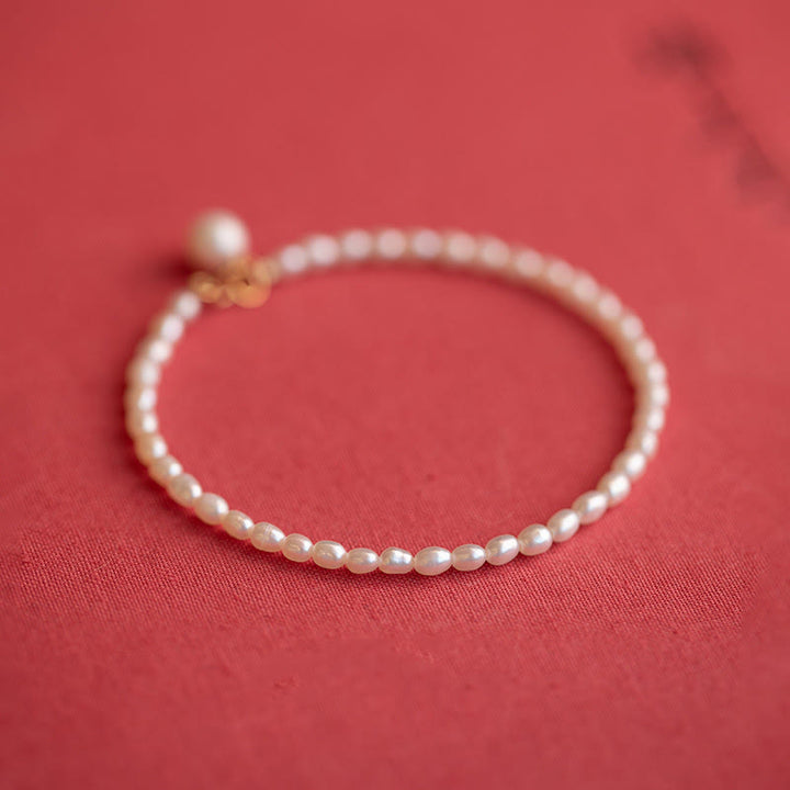 Pulsera de la sabiduría de cobre bañada en oro de 14 k con perlas naturales ultrafinas de 2 mm y Buddha Stones