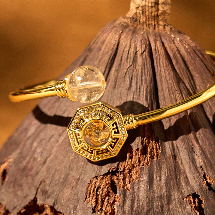 Pulsera brazalete de coraje de Feng Sheng Shui Qi con molino de viento giratorio de cobre y latón con Buddha Stones y cuarzo rutilado