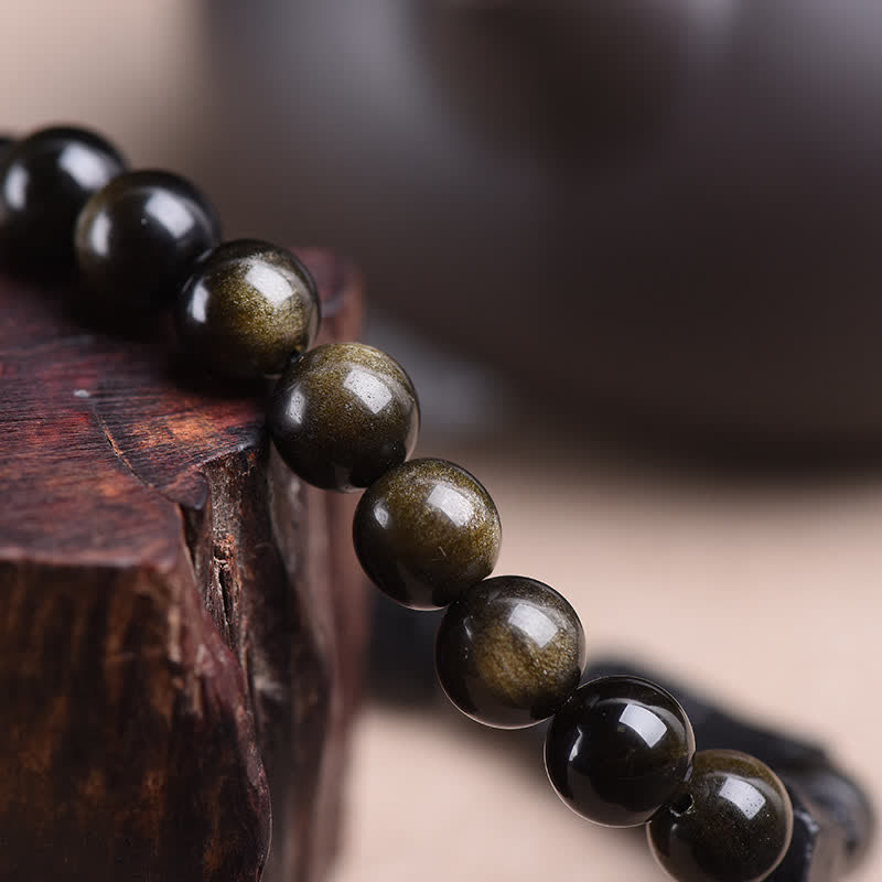 Pulsera de riqueza de turmalina negra obsidiana con brillo dorado de Buddha Stones