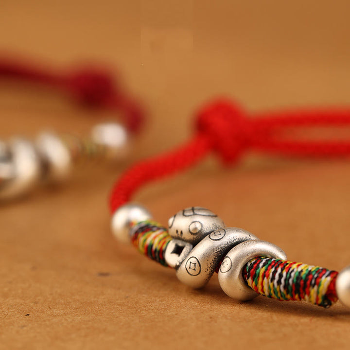 Tobillera con hilo rojo y Buddha Stones en plata de ley 999 con el año de la serpiente